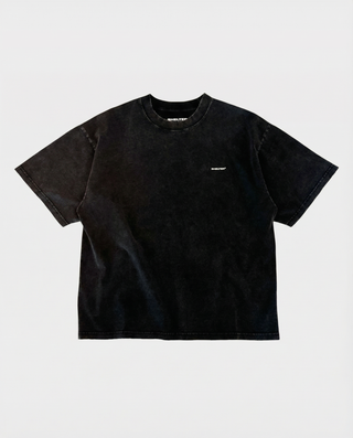 Black t-shirt with a small white logo on a light gray background